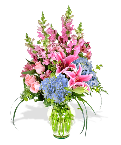 Roses, hydrangea, alstroemeria arranged in a glass urn for Mother's Day