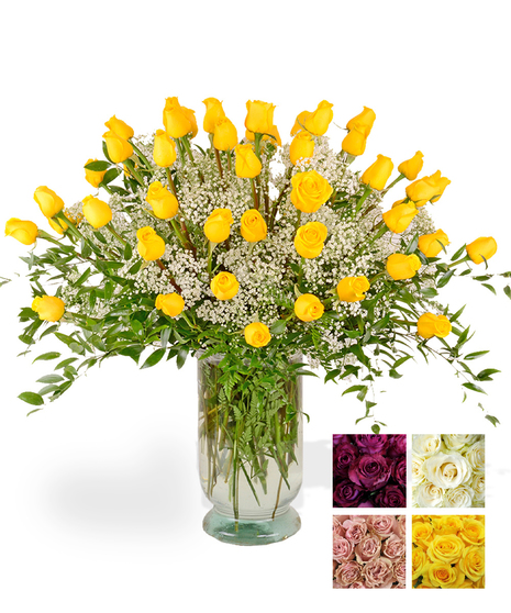 24 Beautiful long stem roses, Complete with greenery & baby's breath and designed in a glass vase.