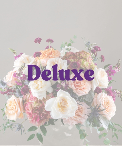 Amber signature flower arrangement by Billy Heroman’s, featuring white garden roses, shimmer roses, and hydrangeas.