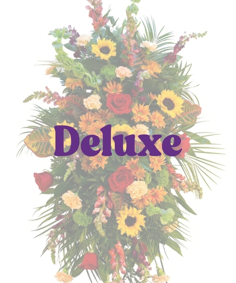 Fall standing spray with sunflowers and fall-colored flowers by Billy Heroman’s in Baton Rouge