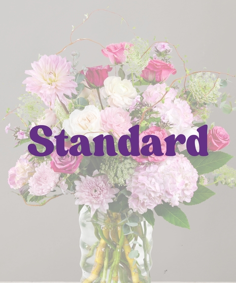 Belle Flower Arrangement: A stunning arrangement of roses, DAHLIAS , and hydrangeas in an elegant vase