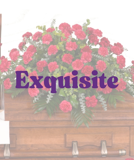 Classic red carnations casket cover with lush greenery from Billy Heroman’s in Baton Rouge, LA