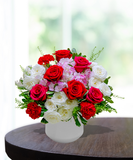 Ruby Spice flower arrangement by Billy Heroman’s, featuring rich red and pink blooms, perfect for July birthdays.