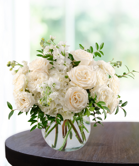 All-white floral arrangement of roses, hydrangea, and stock in a glass vase – Tranquility from Billy Heroman’s