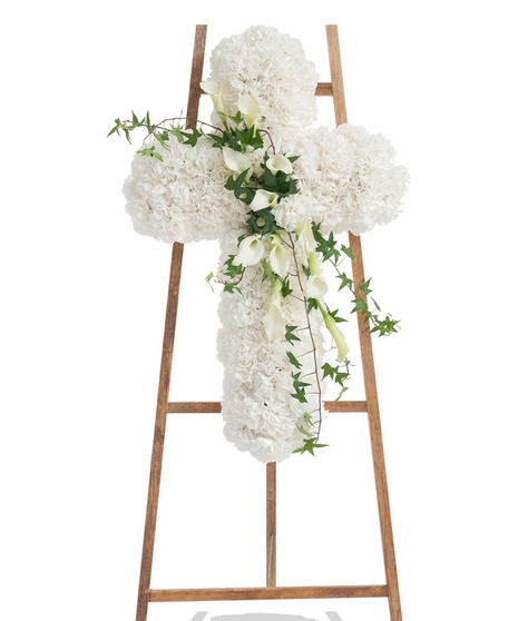 Elegant White Cross Stand with white carnations, cascading calla lilies, and ivy on a wooden easel