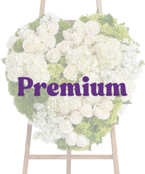 Elegant White Heart Stand with white roses, hydrangeas, and soft greenery on a wooden easel