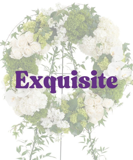 Elegant White Wreath Stand with white roses, hydrangeas, orchids, and green moss on a vine-covered easel