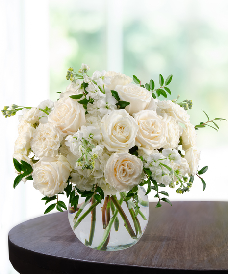 All-white floral arrangement of roses, hydrangea, and stock in a glass vase – Tranquility from Billy Heroman’s