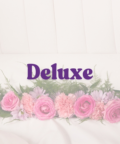 Feminine Casket Lid Piece with pink roses, carnations, lavender daisies, and greenery inside a white open casket
