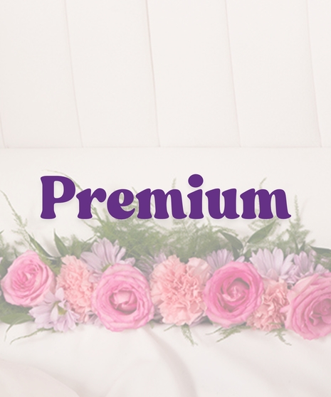 Feminine Casket Lid Piece with pink roses, carnations, lavender daisies, and greenery inside a white open casket