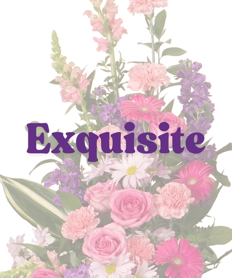 Feminine cremation sidepiece with pink roses, carnations, gerbera daisies, lavender daisies, and greenery
