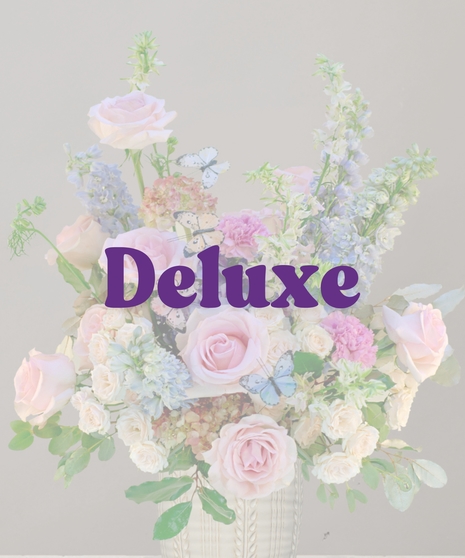 Francesca signature flower arrangement by Billy Heroman’s, featuring a mix of pink flowers and blue hydrangeas, perfect for a new baby or mother.