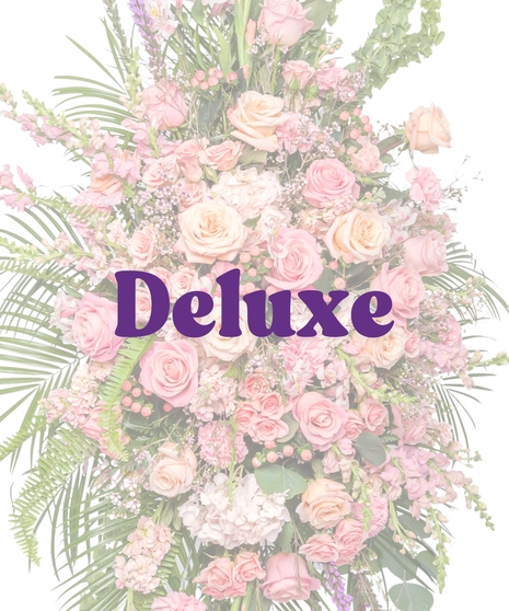 Tall funeral standing spray with pink roses, snapdragons, carnations, and lush greenery on an easel – Tender Blush Suite by Billy Heroman’s