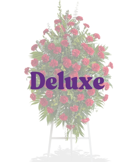 Classic Carnations Funeral Stand with red carnations and greenery from Billy Heroman’s in Baton Rouge, LA
