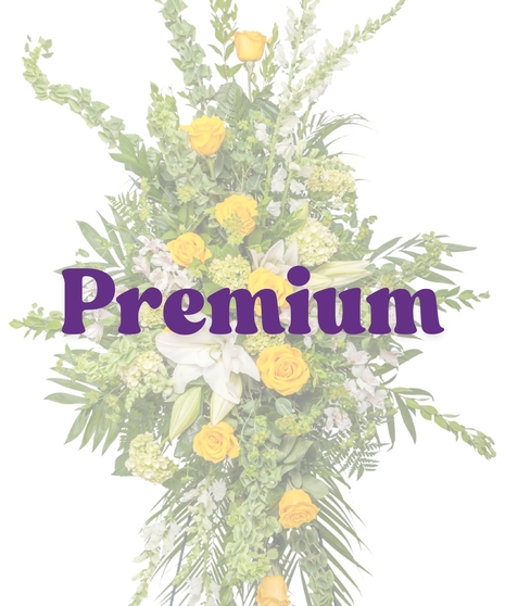 Tall yellow and white standing spray with roses, lilies, alstroemeria, and greenery on an easel from Billy Heroman’s in Baton Rouge