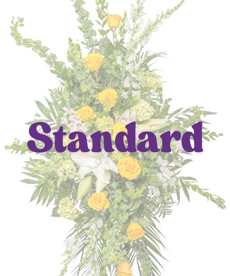 Tall yellow and white standing spray with roses, lilies, alstroemeria, and greenery on an easel from Billy Heroman’s in Baton Rouge