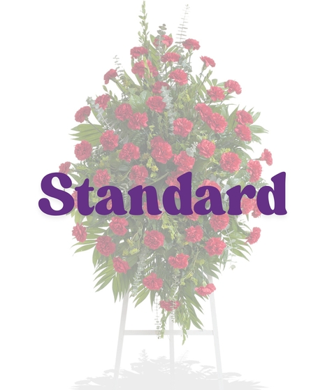Classic Carnations Funeral Stand with red carnations and greenery from Billy Heroman’s in Baton Rouge, LA