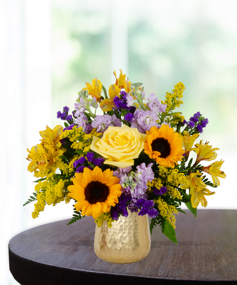 yellow roses, sunflowers, purple stock, purple statice, solidago,  delivered in  Baton Rouge, LA Billy Heroman's
