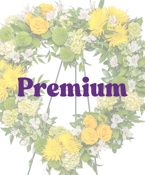 Golden Horizon heart-shaped funeral stand with yellow roses, mums, and white alstroemeria from Billy Heroman’s in Baton Rouge