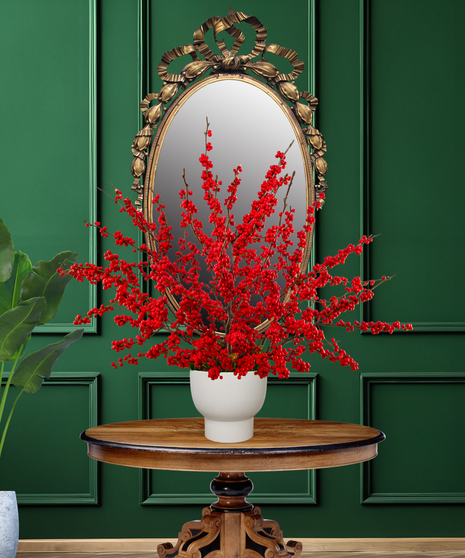 Ilex Berry Christmas arrangement with abundant red Ilex branches in a modern white ceramic vase