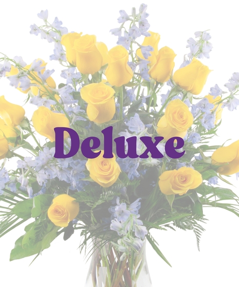 Vase arrangement with yellow roses and blue delphinium honoring Southern University colors