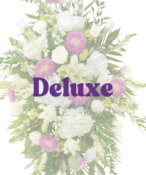 Lavender and white standing spray with roses, hydrangeas, and Fuji mums on easel from Billy Heroman’s
