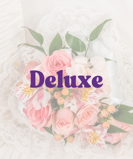 Casket lid piece with peach and pink spray roses, alstroemeria and lace backing inside a white satin-lined casket