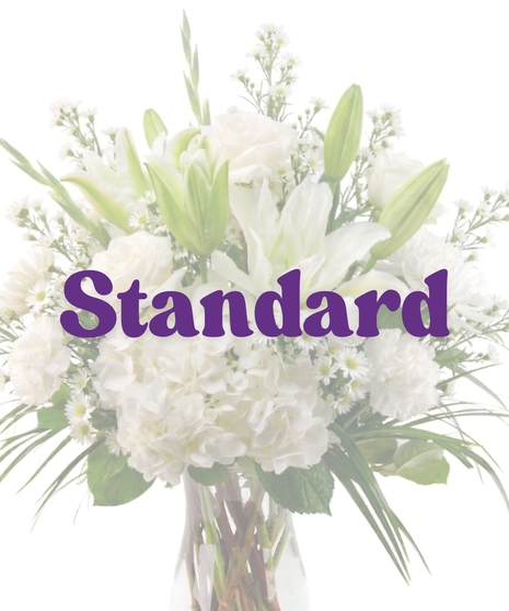 All-white floral arrangement of roses, hydrangea, and stock in a glass vase – Tranquility from Billy Heroman’s