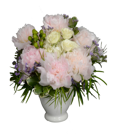 Pastel peonies, roses and hydrangeas arranged in a boat vase for Mother's Day