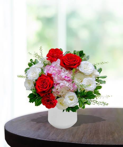 Ruby Spice flower arrangement by Billy Heroman’s, featuring rich red and pink blooms, perfect for July birthdays.