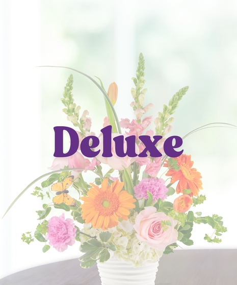 Pink Lemonade summer flower arrangement by Billy Heroman’s, featuring a mix of pink and orange flowers.