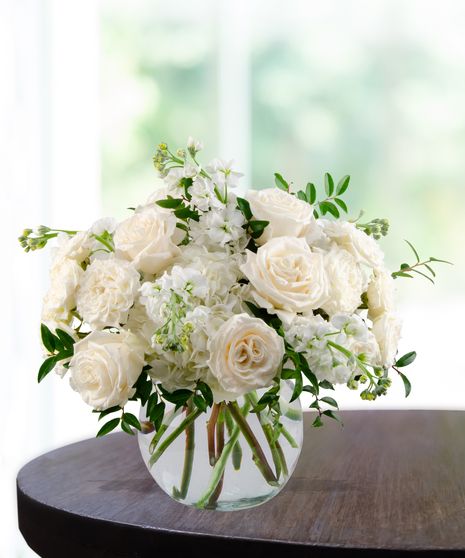 All-white floral arrangement of roses, hydrangea, and stock in a glass vase – Tranquility from Billy Heroman’s