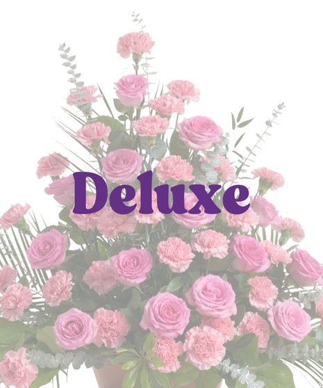 Roses & Carnations Floor Piece with pink roses, pink carnations, eucalyptus, and palm leaves in a triangular funeral display