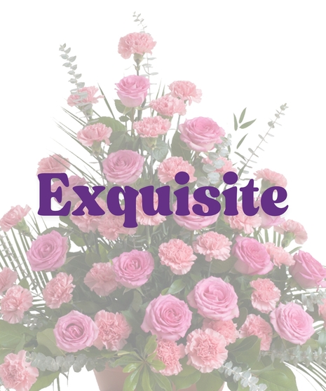 Roses & Carnations Floor Piece with pink roses, pink carnations, eucalyptus, and palm leaves in a triangular funeral display