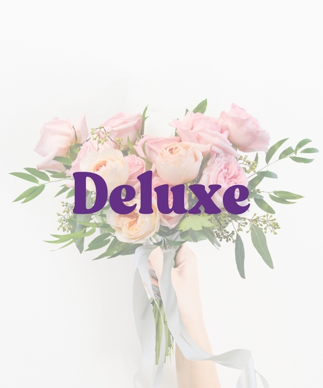 Runway Diva handheld bouquet with blush and pink roses, greenery, and ribbons for Homecoming or Prom