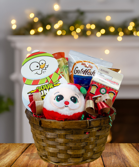 Polar Express Christmas Candy Basket filled with holiday treats, chocolates, peppermint candies, and festive decorations from Billy Heroman's Florist in Baton Rouge, LA.