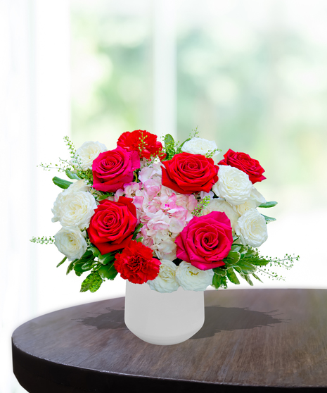 Ruby Spice flower arrangement by Billy Heroman’s, featuring rich red and pink blooms, perfect for July birthdays.