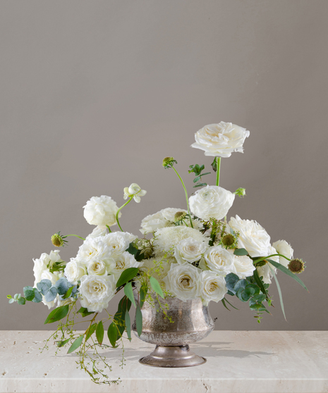 Sydney signature flower arrangement by Billy Heroman’s, featuring all white roses, spray roses, ranunculus, and more.