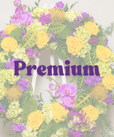 Tiger Pride Funeral Wreath Stand with yellow roses, purple orchids, and cascading greenery