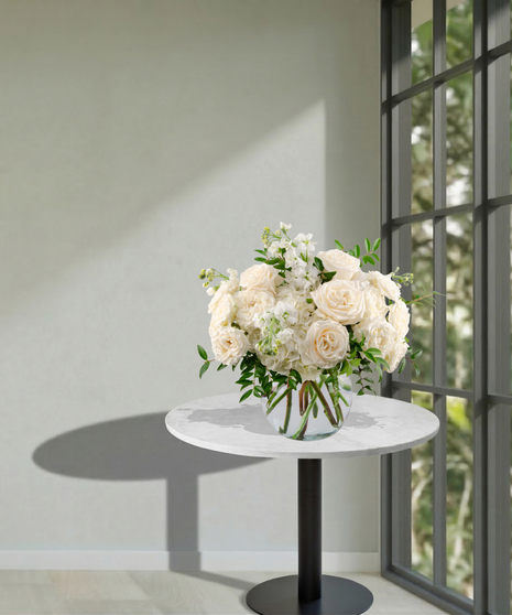 All-white floral arrangement of roses, hydrangea, and stock in a glass vase – Tranquility from Billy Heroman’s