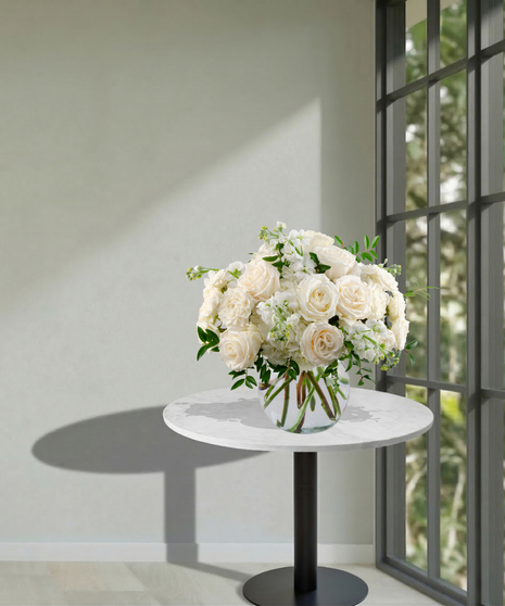 All-white floral arrangement of roses, hydrangea, and stock in a glass vase – Tranquility from Billy Heroman’s