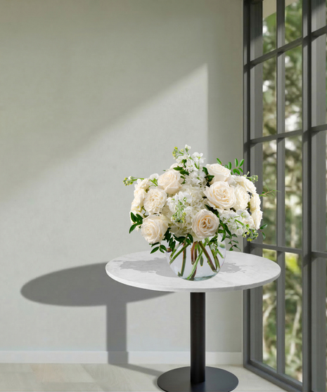 All-white floral arrangement of roses, hydrangea, and stock in a glass vase – Tranquility from Billy Heroman’s