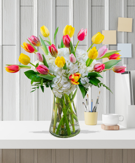 Multicolored tulips and white hydrangea arrangement - Delivered in Baton Rouge by Billy Heroman's