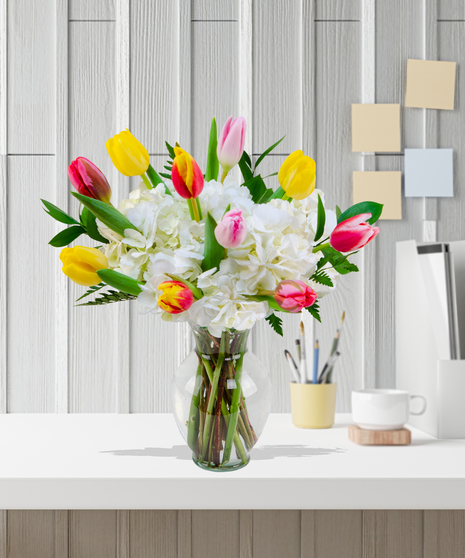 Multicolored tulips and white hydrangea arrangement - Delivered in Baton Rouge by Billy Heroman's