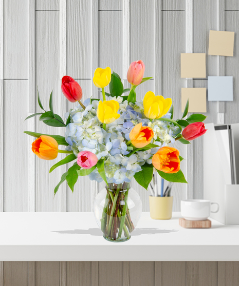 Tulip Treasures Flower Arrangement for Mother's Day: A stunning display of vibrant tulips in a chic vase