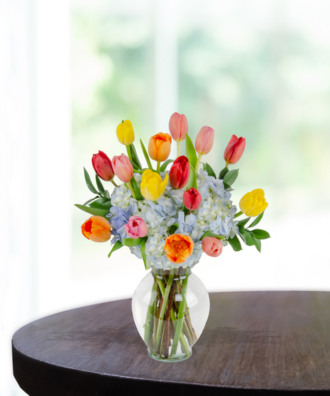 Tulip Treasures Flower Arrangement for Mother's Day: A stunning display of vibrant tulips in a chic vase