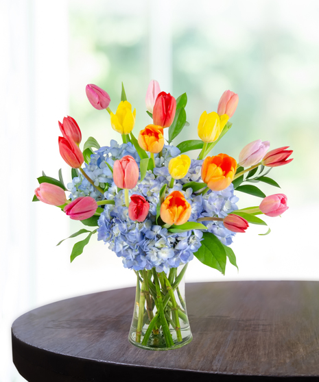 Tulip Treasures Flower Arrangement for Mother's Day: A stunning display of vibrant tulips in a chic vase