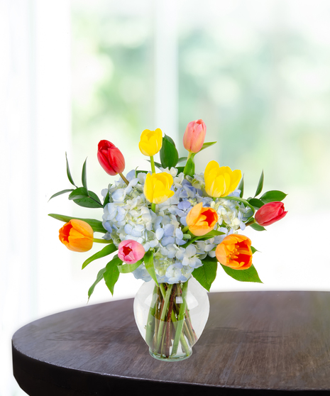 Tulip Treasures Flower Arrangement for Mother's Day: A stunning display of vibrant tulips in a chic vase
