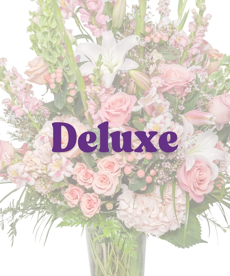 Tall sympathy vase arrangement with pink roses, white lilies, snapdragons, and Bells of Ireland – Tender Blush Suite by Billy Heroman’s