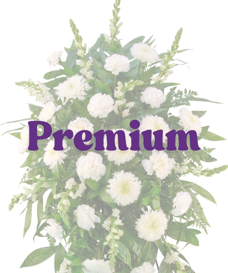 White Promises funeral stand with all-white carnations, spider mums, snapdragons, and greenery on a standing easel – Billy Heroman’s Baton Rouge